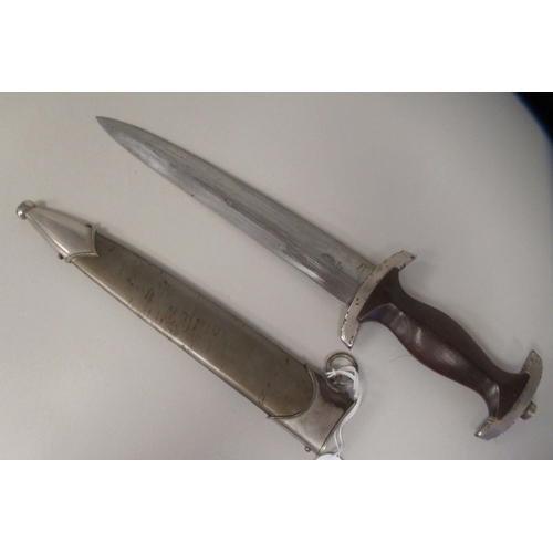 218 - A German Third Reich era SA (Sturmabteilung) dress dagger, the moulded maplewood handle with inset e... 