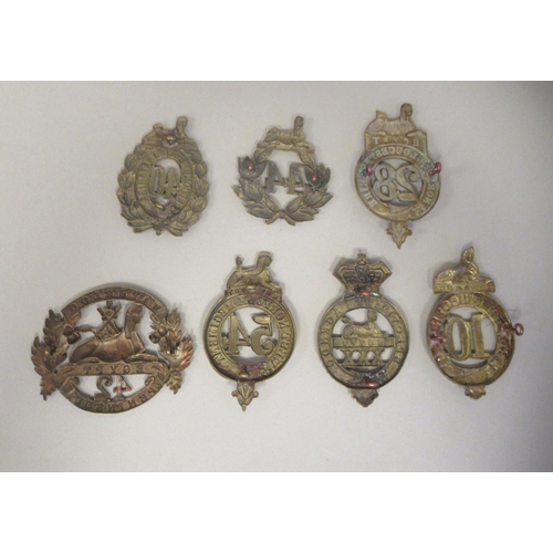 224 - Seven 19thC military brass cap badges, some copies: to include West Norfolk Regt.(Please Note: this ... 