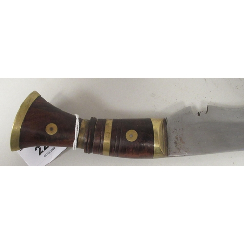 228 - An Asian Kukri with a brass mounted hardwood handle  the blade 12