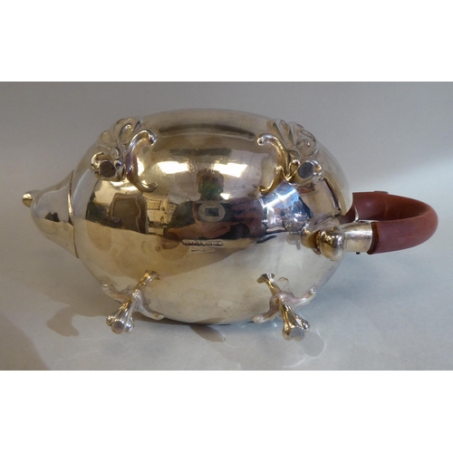 23 - A three piece silver tea set of oval, bulbous form with angled, pierced upstand rims, comprising a t... 