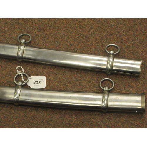 235 - Six various 20thC iron tsubas, two similar polished, stainless steel scabbards with suspension rings... 