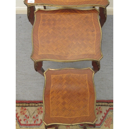 238 - An early/mid 20thC Louis XVI style nesting set of three Continental kingwood and parquetry tables wi... 