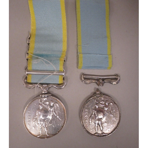 244 - A Crimea medal with Queen Victoria's profile portrait on the obverse and ribbon; three oakleaf bars ... 