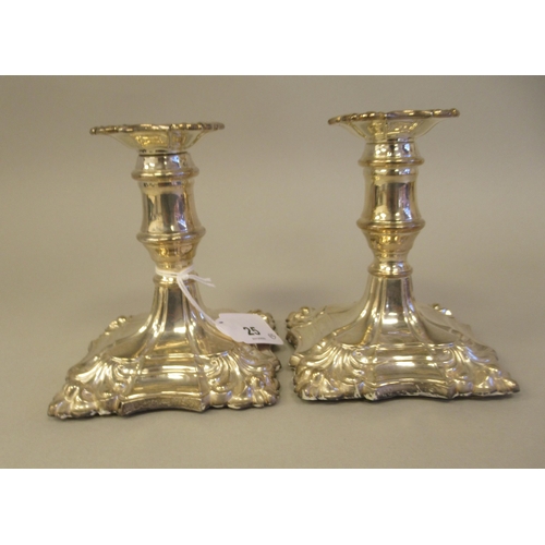 25 - A pair of 18/19thC style loaded silver dwarf candlesticks, each with a detachable sconce and vase sh... 