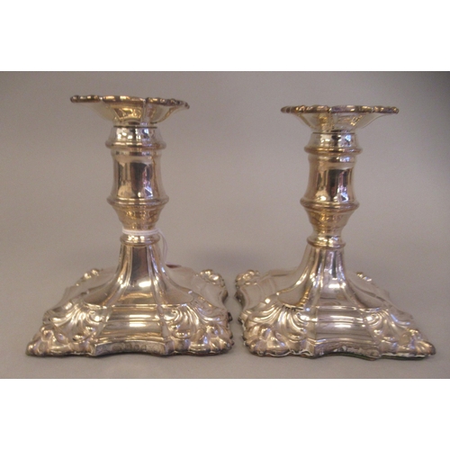 25 - A pair of 18/19thC style loaded silver dwarf candlesticks, each with a detachable sconce and vase sh... 