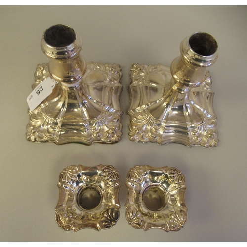 25 - A pair of 18/19thC style loaded silver dwarf candlesticks, each with a detachable sconce and vase sh... 