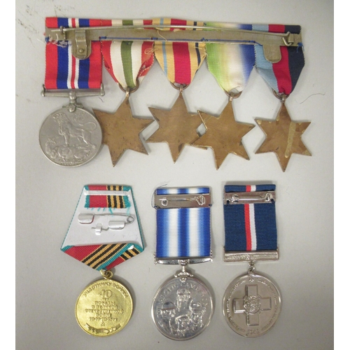 252 - A 1939-1945 British War medal and ribbons; The 1939-1945 Star; The Atlantic Star; The Italy Star; an... 