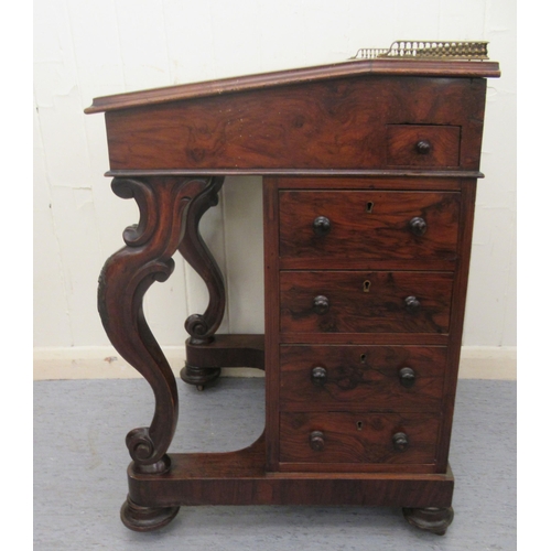 256 - A mid Victorian walnut Davenport with a brass galleried top and an angled, hinged, tooled green hide... 