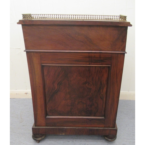 256 - A mid Victorian walnut Davenport with a brass galleried top and an angled, hinged, tooled green hide... 