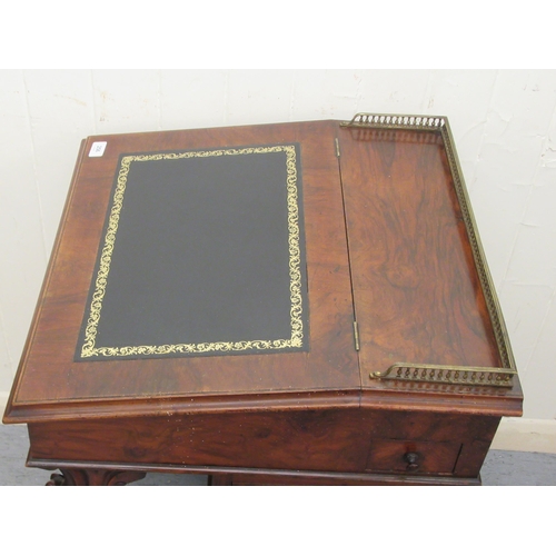 256 - A mid Victorian walnut Davenport with a brass galleried top and an angled, hinged, tooled green hide... 