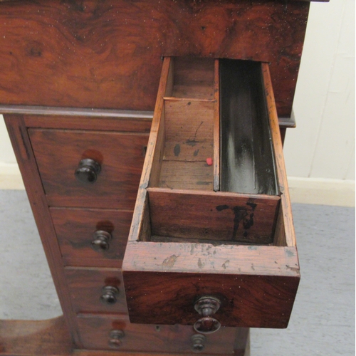 256 - A mid Victorian walnut Davenport with a brass galleried top and an angled, hinged, tooled green hide... 