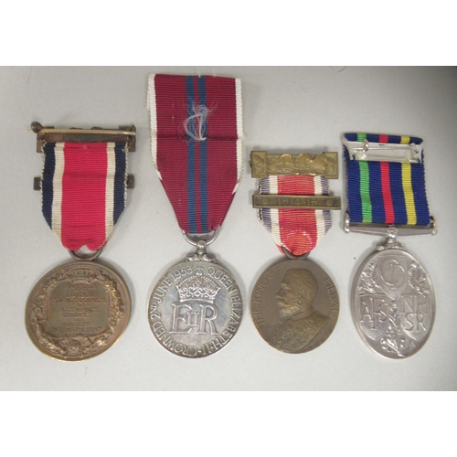 265 - Two King George V medals awarded by the LCC for Attendance, Conduct and Industry during the years 19... 