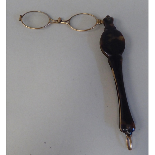 27 - Two late 19th/early 20thC yellow/gold coloured metal and tortoiseshell mounted lorgnettes 