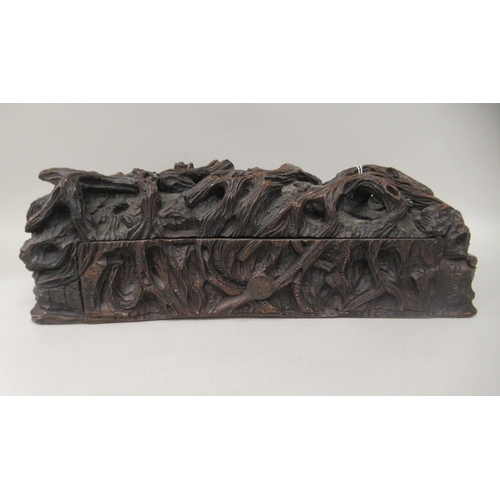 273 - A 19thC Black Forest deskstand, naturalistically carved as a woodland floor, incorporating a pen cha... 