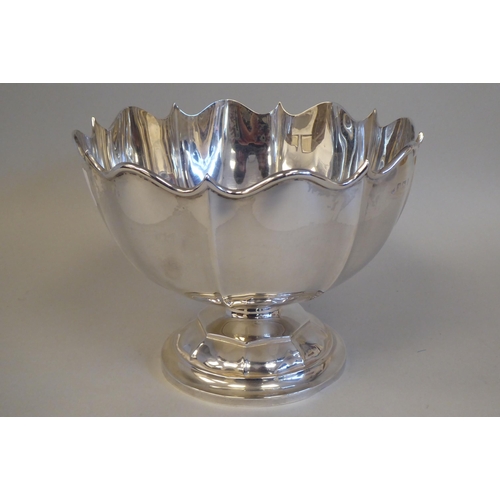 28 - An Edwardian silver Monteith with an applied wire, scalloped rim, on a pedestal foot  indistinct Bir... 