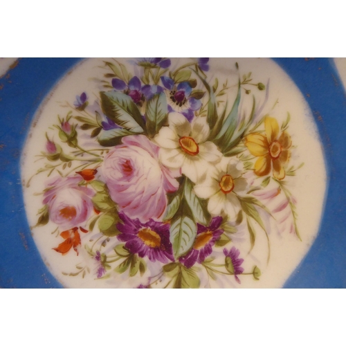 3 - A 19thC Serves porcelain shallow dish, decorated with gilded vignette studies of mixed flora, on a p... 