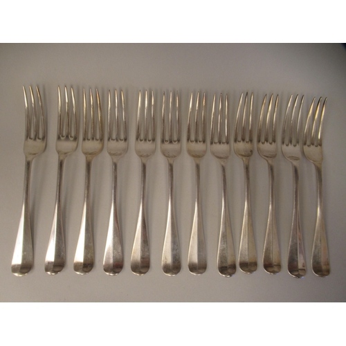 33 - Silver Hanoverian pattern flatware, viz. twelve table forks, twelve dessert forks and six spoons; pl... 