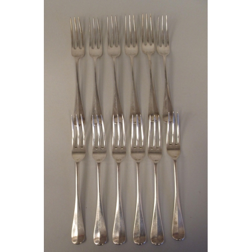 33 - Silver Hanoverian pattern flatware, viz. twelve table forks, twelve dessert forks and six spoons; pl... 