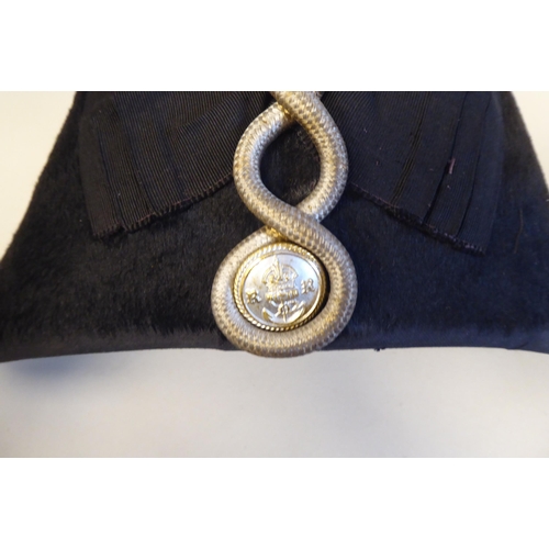 34 - A naval black cocked hat with braid and a feather plume, size 7, in a painted tinplate box (Please N... 