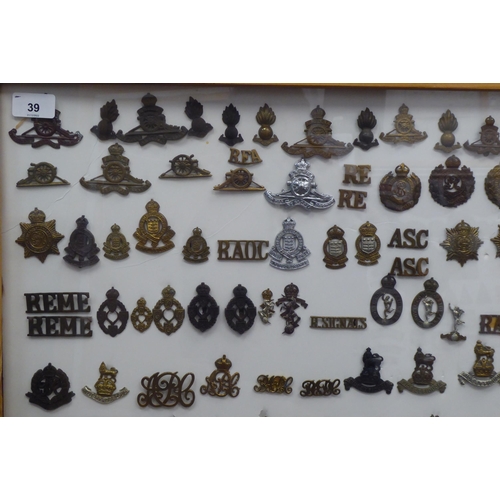 39 - Over one hundred and twenty military cap badges and other insignia, some copies: to include Royal Ar... 