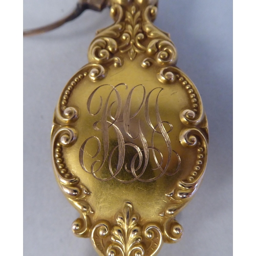 43 - A late 19thC gilt metal mounted lorgnette, decoratively cast with engraved and other ornament and co... 