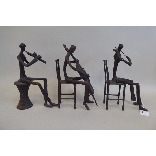 44 - In the manner of Giacometti - a series of three painted bronze sculptures, featuring seated jazz mus... 