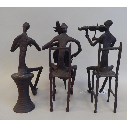 44 - In the manner of Giacometti - a series of three painted bronze sculptures, featuring seated jazz mus... 