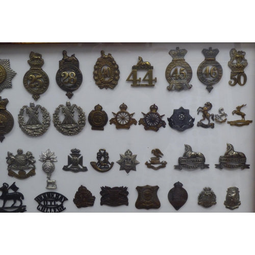 46 - Over ninety military cap badges and other insignia, some copies: to include 1st Battalion, Blackpool... 