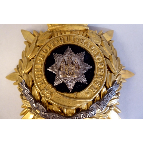 47 - An East Surrey Regiment helmet plate (Please Note: this lot is subject to the statement made in the ... 