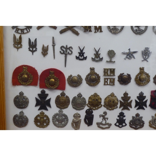 48 - Over one hundred and twenty military cap badges and other insignia, some copies: to include Glider R... 