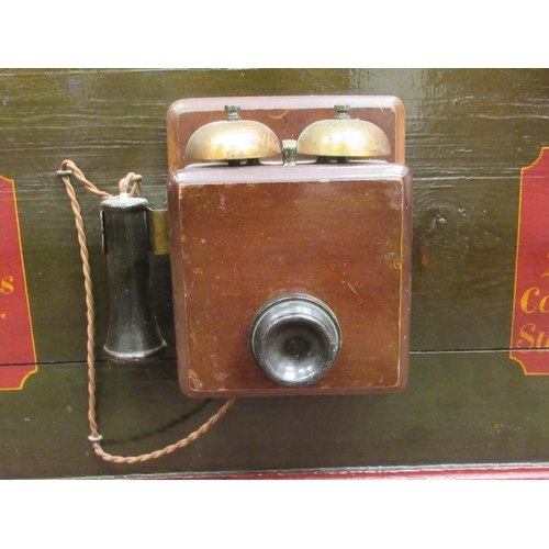 51 - A painted wooden wall plaque for the National Telephone Company, mounted with a telephone handset, a... 