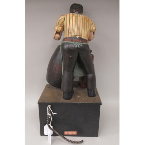 53 - A Ron Fuller painted wood, mains powered automata, featuring the cooper on the roof of The Chandos P... 