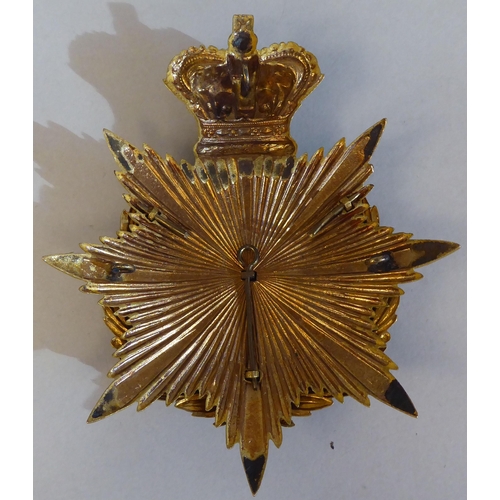 55 - A Dorsetshire Regiment military helmet plate (Please Note: this lot is subject to the statement made... 