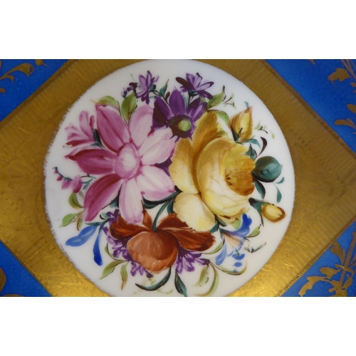 6 - A 19thC Serves porcelain plate, decorated in sponged blue, mixed flora and painted in gilt  12