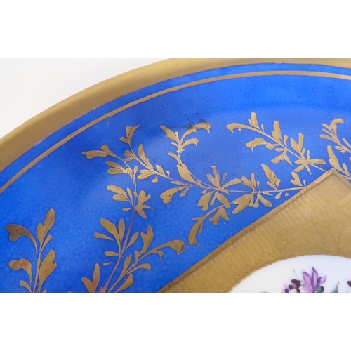 6 - A 19thC Serves porcelain plate, decorated in sponged blue, mixed flora and painted in gilt  12