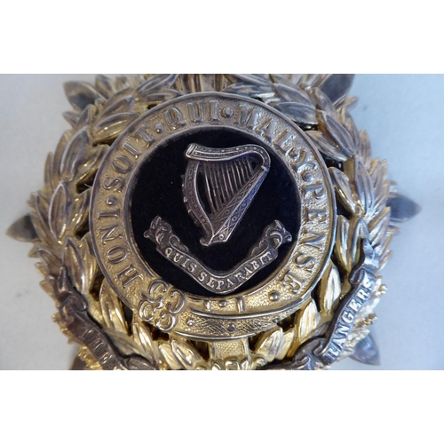 60 - A Connaught Rangers military helmet plate (Please Note: this lot is subject to the statement made in... 