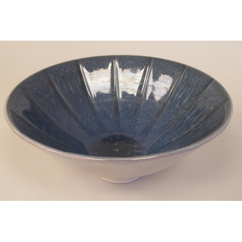 64 - A Norman Wilson Wedgwood two tone blue and speckled grey glazed shallow fluted and footed china bowl... 