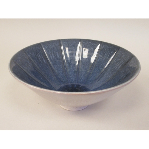 64 - A Norman Wilson Wedgwood two tone blue and speckled grey glazed shallow fluted and footed china bowl... 