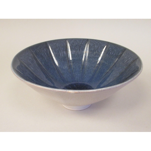 64 - A Norman Wilson Wedgwood two tone blue and speckled grey glazed shallow fluted and footed china bowl... 