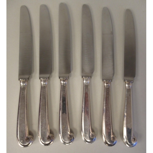 65 - A set of eight silver pistol grip handled table knives with stainless steel blades; and a matching s... 