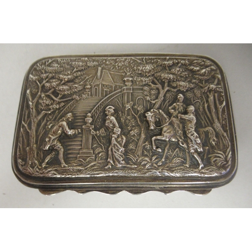 67 - An Edwardian silver trinket box with straight sides and a hinged lid, repousse worked with 18thC fig... 