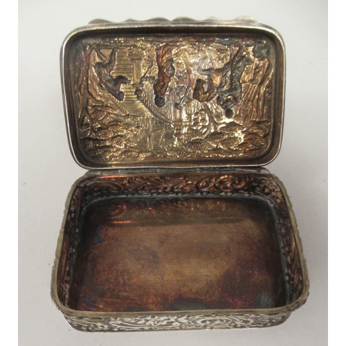 67 - An Edwardian silver trinket box with straight sides and a hinged lid, repousse worked with 18thC fig... 