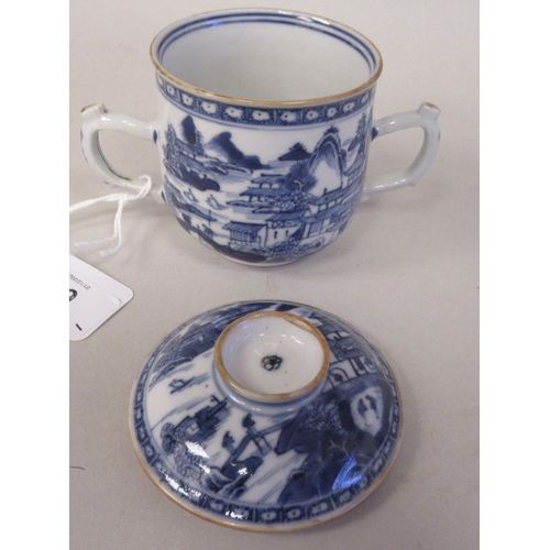 69 - A late 18thC Chinese porcelain twin handled cup and cover, decorated in blue and white with figures,... 