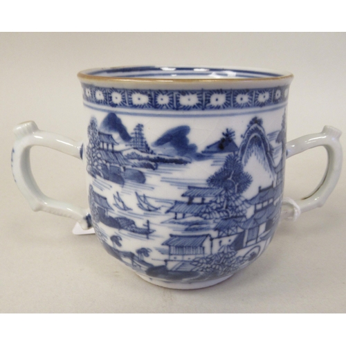 69 - A late 18thC Chinese porcelain twin handled cup and cover, decorated in blue and white with figures,... 