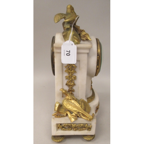 70 - An early 20thC French mottled grey onyx and decoratively cast gilt metal mounted mantel clock with s... 