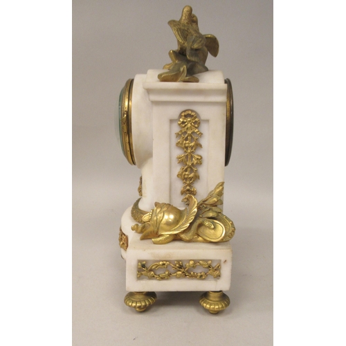 70 - An early 20thC French mottled grey onyx and decoratively cast gilt metal mounted mantel clock with s... 