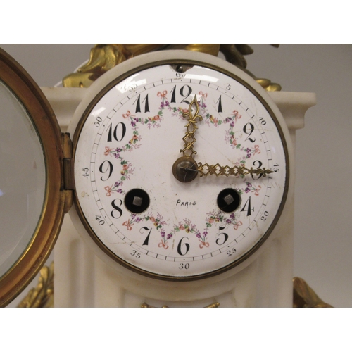 70 - An early 20thC French mottled grey onyx and decoratively cast gilt metal mounted mantel clock with s... 