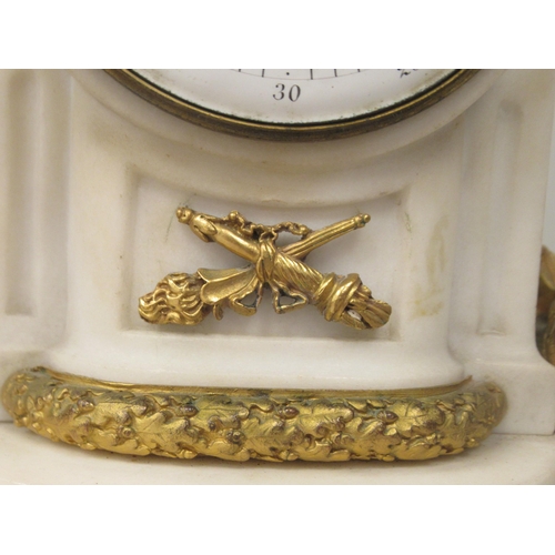 70 - An early 20thC French mottled grey onyx and decoratively cast gilt metal mounted mantel clock with s... 