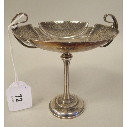 72 - An Art Nouveau silver pedestal sweet dish with opposing looped wire handles, elevated on a slender o... 