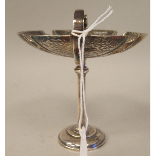 72 - An Art Nouveau silver pedestal sweet dish with opposing looped wire handles, elevated on a slender o... 